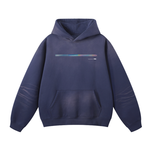 The ODMPOD UH014 Hoodie in navy blue features a front pocket, a drawstring hood, and a horizontal, multicolored stripe on the front with tiny text beneath it. Subtle fading around certain areas adds a unique touch to its design. For the perfect fit, refer to the size chart for precise chest measurements and sleeve length.