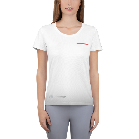 A person with long hair is wearing a white WT001 ▪ T-shirt by C3 with a small red rectangular design on the chest, made from sports mesh fabric for comfortable fit and moisture management. The person is also wearing light grey pants and is standing against a plain background.