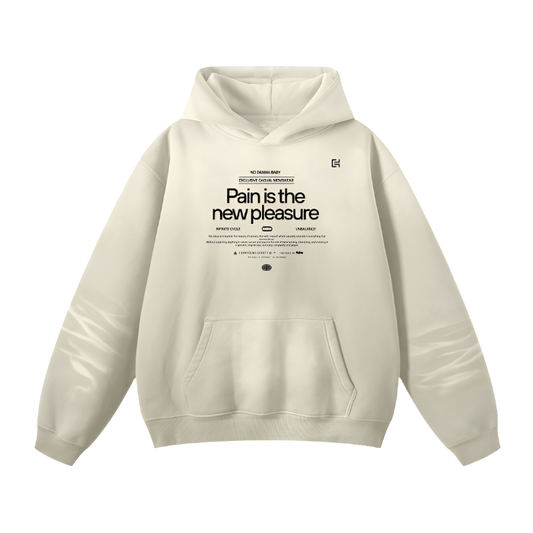 Introducing the UH015 Hoodie by ODMPOD – a beige unisex hoodie featuring bold black text on the front that reads, "Pain is the new pleasure". This loose fit casual hoodie also includes additional smaller text and symbols above and below the main message, creating a unique graphic design. For added convenience, it comes with a front pocket.