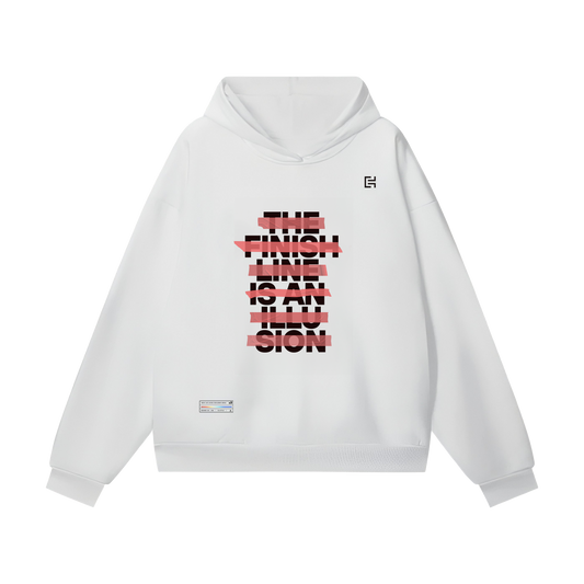 Introducing the UH026 Hoodie by ODMPOD – a white, oversized hooded sweatshirt that features a striking graphic design on the front. The design boldly displays the text "THE FINISH LINE IS AN ILLUSION" in black and red, accentuated with a striped pattern that gives it a fragmented look. Perfectly suited for winter and unisex fashion.