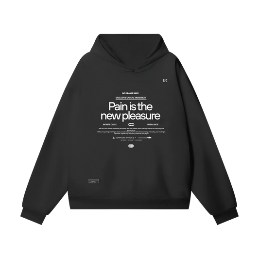 Introducing the ODMPOD UH025 Hoodie, a unisex black hoodie perfect for winter. It showcases bold white text reading "Pain is the new pleasure." Accompanied by smaller phrases and a subtle rectangle logo, this hoodie features an oversized fit, front pocket, and drawstrings, providing both comfort and style.